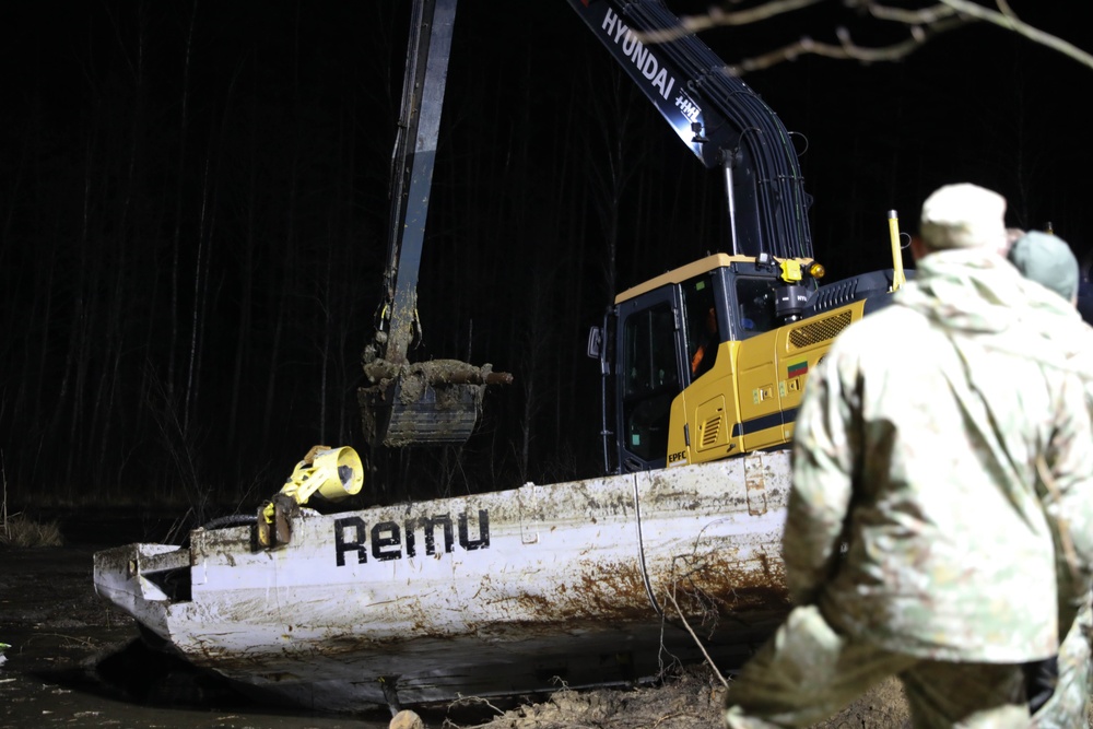 Recovery Efforts Continue Through the Night at Site of Submerged Vehicle in Search for Missing Soldiers