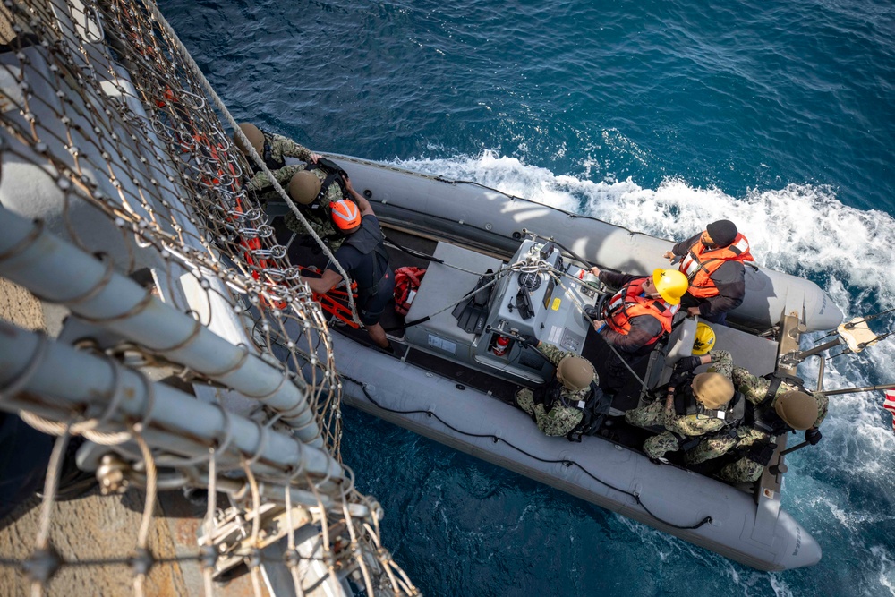 U.S. Coast Guard conducts small boat operations with U.S. Navy Sailors