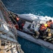 U.S. Coast Guard conducts small boat operations with U.S. Navy Sailors