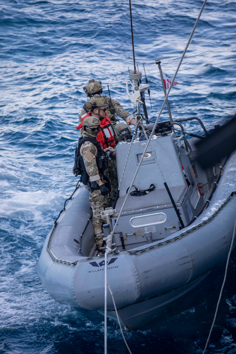 U.S. Coast Guard conducts small boat operations with U.S. Navy Sailors
