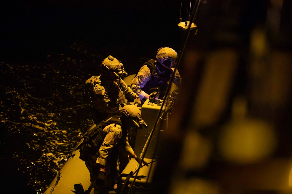 U.S. Coast Guard conducts small boat operations with U.S. Navy Sailors