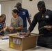 Navy Volunteers Help Aiea Public Library Organize Books for Annual Book Sale