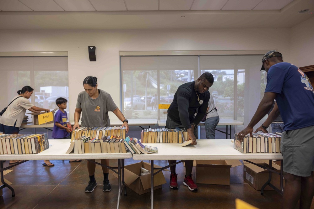 Navy Volunteers Help Aiea Public Library Organize Books for Annual Book Sale
