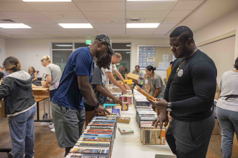 Navy Volunteers Help Aiea Public Library Organize Books for Annual Book Sale