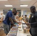Navy Volunteers Help Aiea Public Library Organize Books for Annual Book Sale