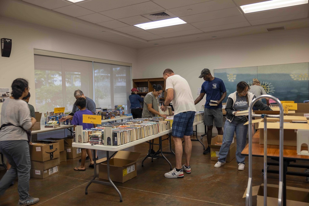 Navy Volunteers Help Aiea Public Library Organize Books for Annual Book Sale