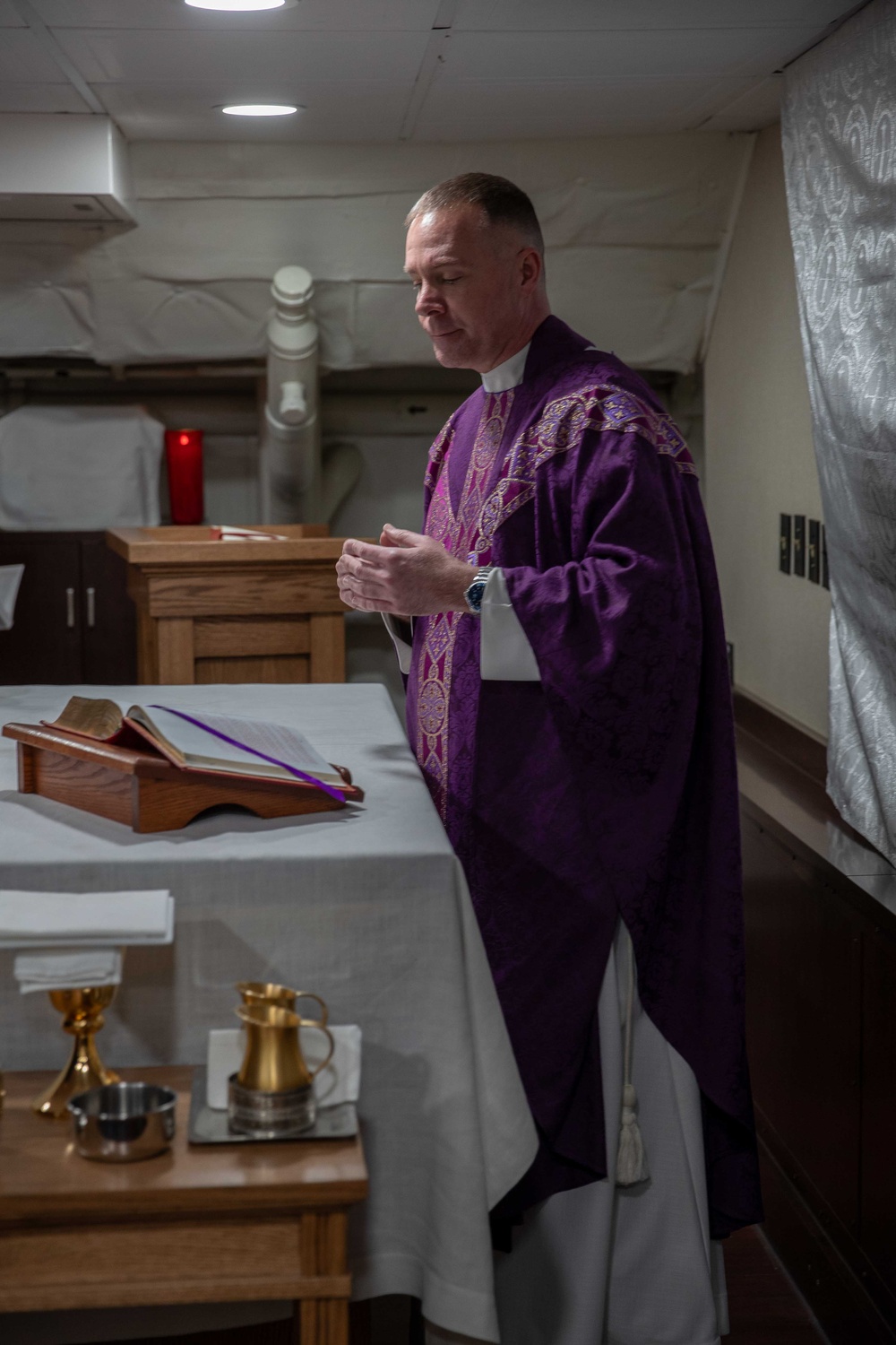 Cmdr. Ben Garrett leads Ash Wednesday services aboard the USS George Washington (CVN 73)