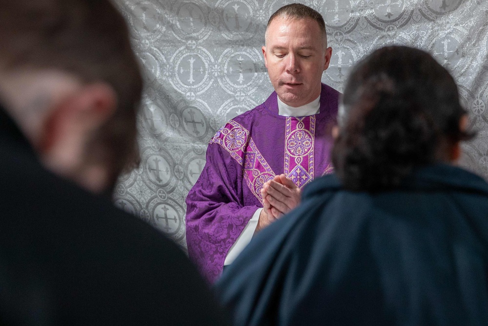 Cmdr. Ben Garrett leads Ash Wednesday services aboard the USS George Washington (CVN 73)