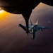 CENTCOM KC-135 Stratotanker conducts nighttime aerial refueling with F/A-18 Super Hornets