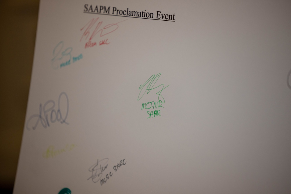 Quantico Base Leadership and SAPR personnel sign 2025 SAAPM Proclamation