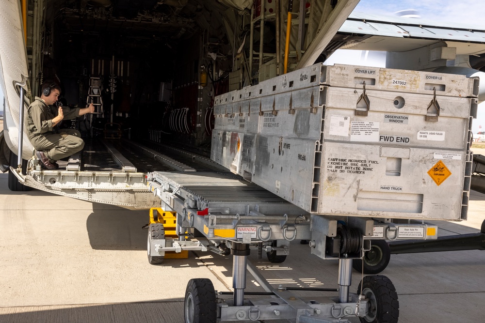MAG-11 Marines load weapons and equipment using Marine adjustable cargo trailer