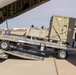 MAG-11 Marines load weapons and equipment using Marine adjustable cargo trailer