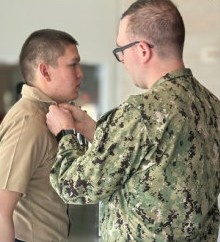 Navy Hospital Corpsmen assigned to Navy Medicine and Readiness Training Command-Fort Belvoir get pinned to Petty Officer Third Class.