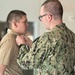 Navy Hospital Corpsmen assigned to Navy Medicine and Readiness Training Command-Fort Belvoir get pinned to Petty Officer Third Class.