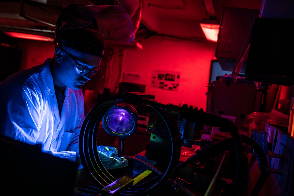 Nimitz Sailor Utilizes a Magnetic Particle Bench to Test Parts