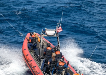 U.S. Coast Guard Cutter Kimball conducts small boat pursuit training and flight operations