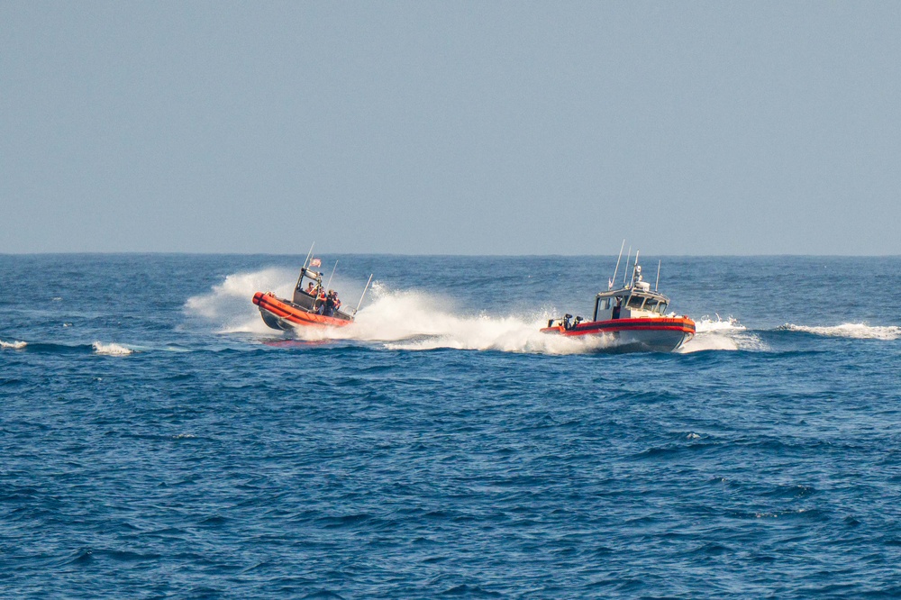 U.S. Coast Guard Cutter Kimball conducts small boat pursuit training and flight operations