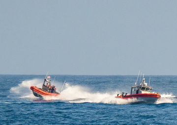 U.S. Coast Guard Cutter Kimball conducts small boat pursuit training and flight operations
