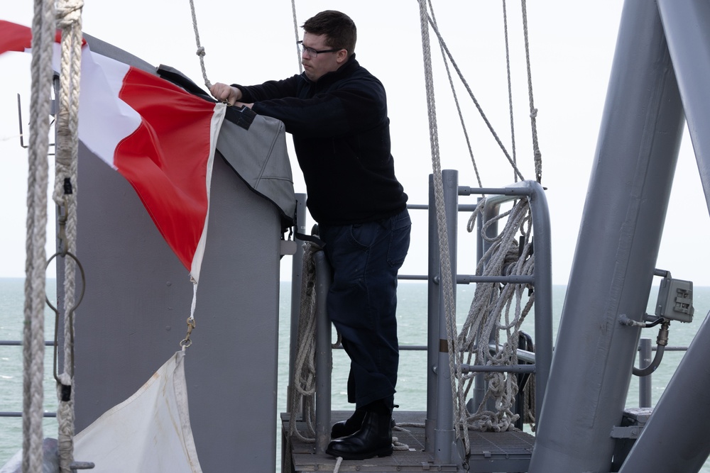 Iwo Jima Sailor Lowers Flags