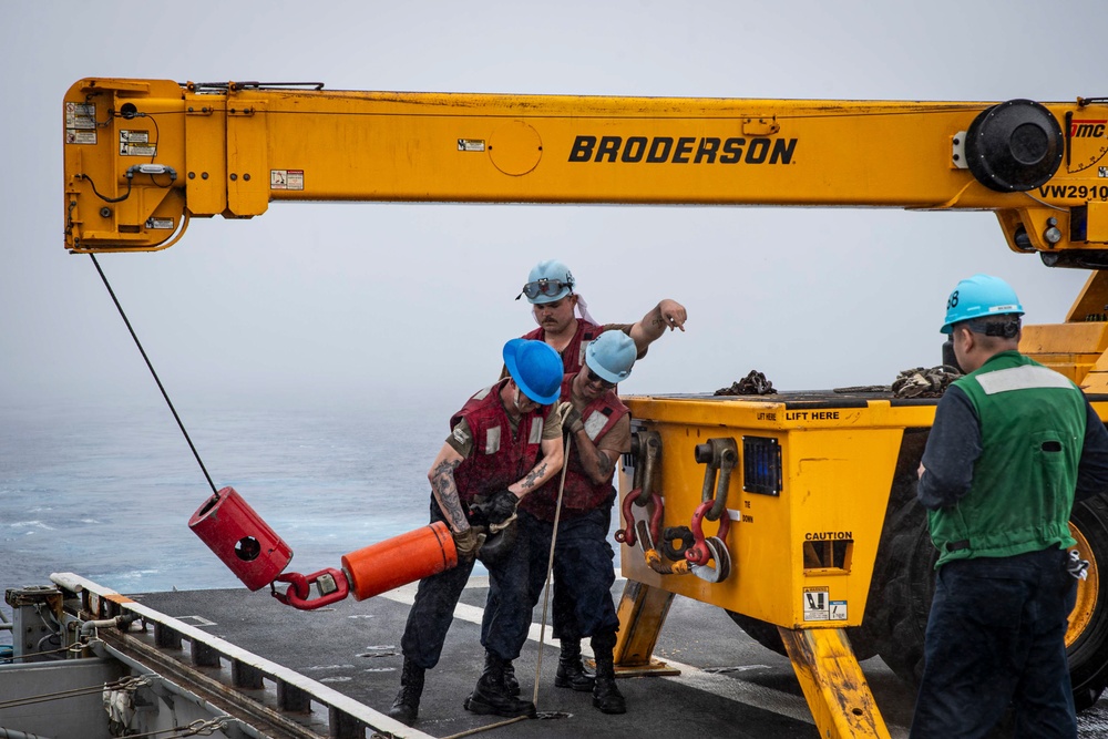 Nimitz Sailors Operate Crane During Ammunition Onload