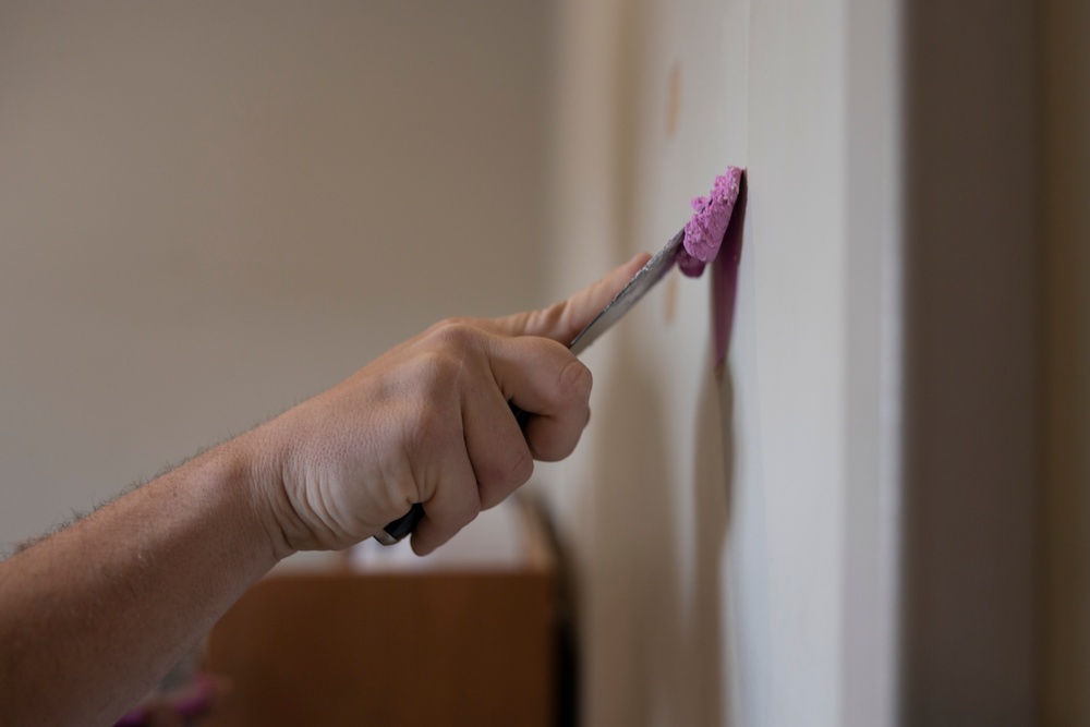 Marines repair barracks walls as part of Operation Clean Sweep-II