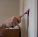 Marines repair barracks walls as part of Operation Clean Sweep-II