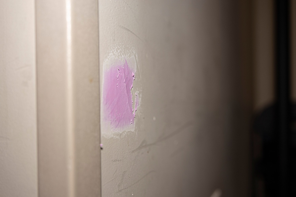 Marines repair barracks walls as part of Operation Clean Sweep-II