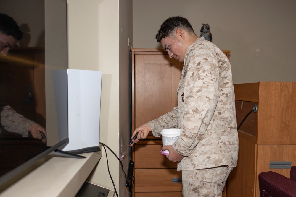 Marines repair barracks walls as part of Operation Clean Sweep-II