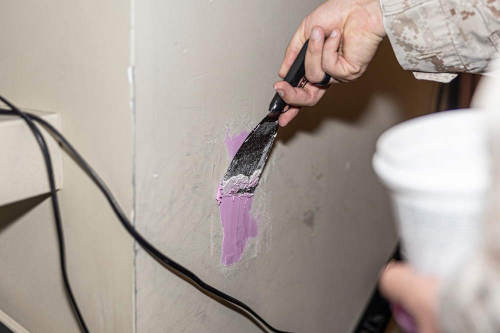 Marines repair barracks walls as part of Operation Clean Sweep-II
