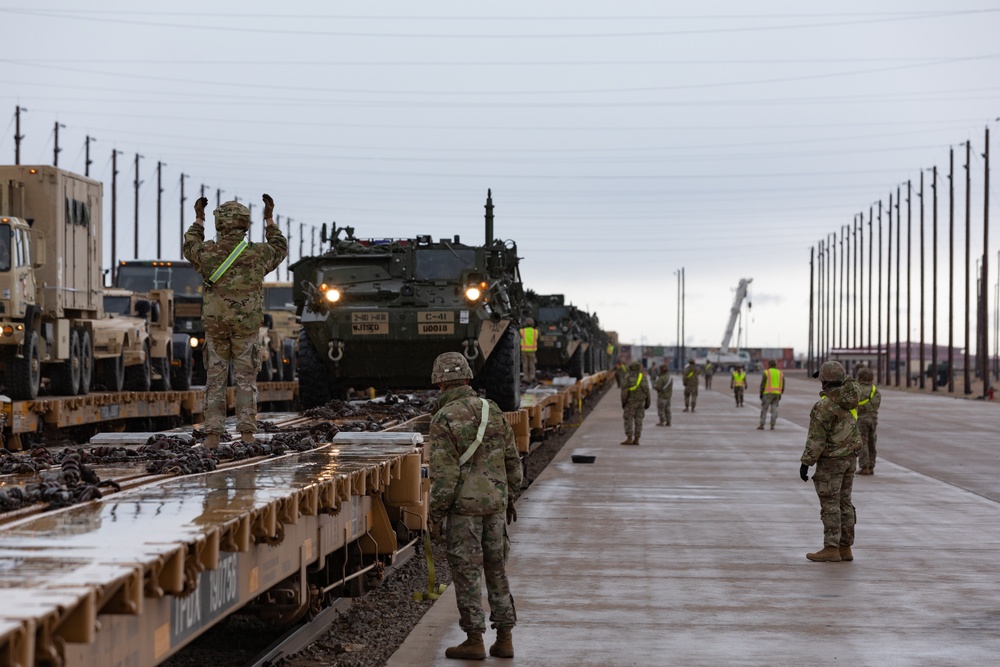U.S. Soldiers offload approximately Stryker armored vehicles