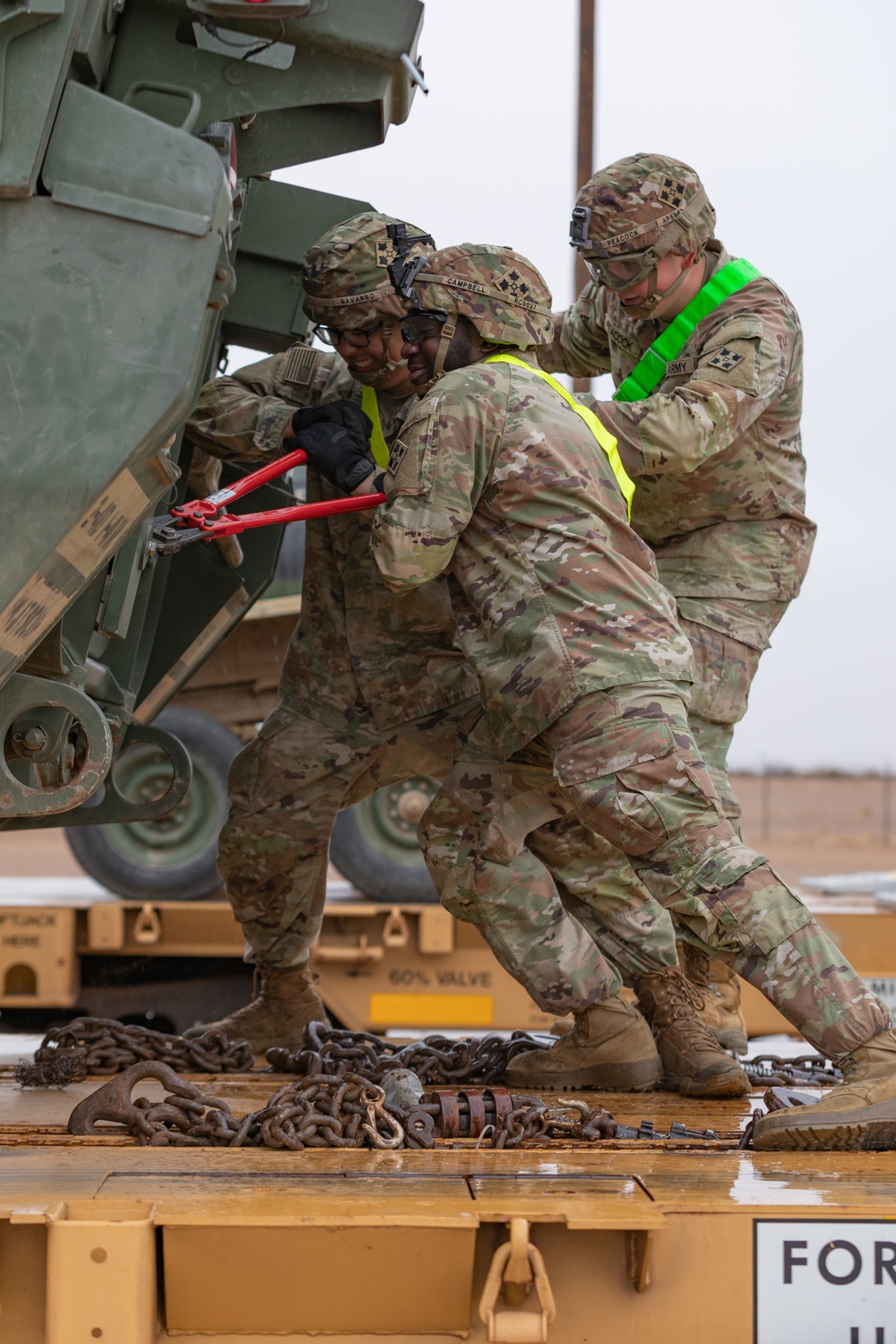 U.S. Soldiers offload approximately Stryker armored vehicles