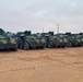 U.S. Soldiers move and ground guide Stryker combat vehicles to a motorpool