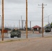 U.S. Soldiers move and ground guide Stryker combat vehicles to a motorpool