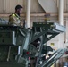 U.S. Soldiers move and ground guide Stryker combat vehicles to a motorpool