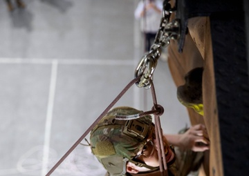 U.S. and Indian Soldiers climb rock wall during Tiger Triumph
