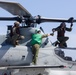 Marines onboard USS Iwo Jima secure AH-1W SuperCobra helicopter