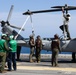 Marines onboard USS Iwo Jima secure AH-1W SuperCobra helicopter