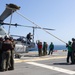 Marines onboard USS Iwo Jima secure AH-1W SuperCobra helicopter
