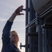 Fire Controlmen onboard USS Iwo Jima perform maintenance on NATO Sea Sparrow