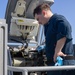 Fire Controlmen onboard USS Iwo Jima perform maintenance on NATO Sea Sparrow