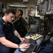 Sailor and Marines Calibrate Equipment On Board USS Iwo Jima