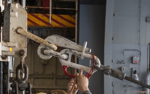 Nimitz Sailor Threads Line Through a Pelican Hook During a Replenishment-at-Sea