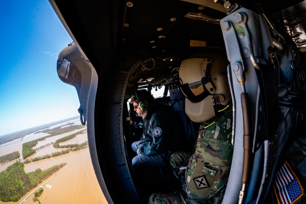 FEMA and Arkansas National Guard patrol disaster area