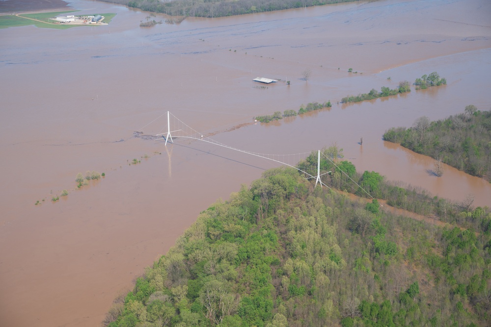FEMA and Arkansas National Guard patrol disaster area