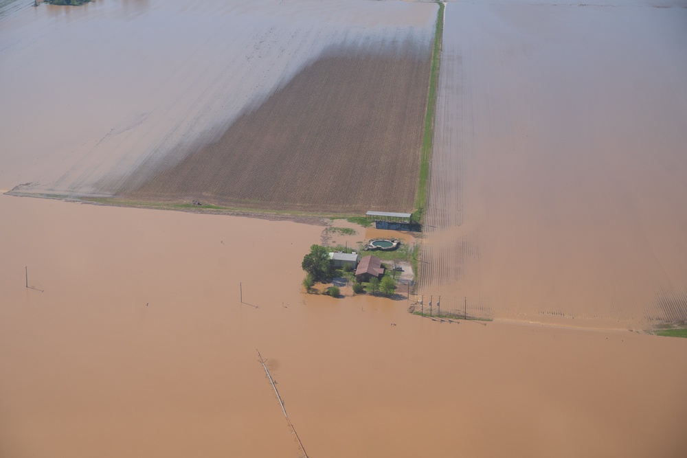 FEMA and Arkansas National Guard patrol disaster area