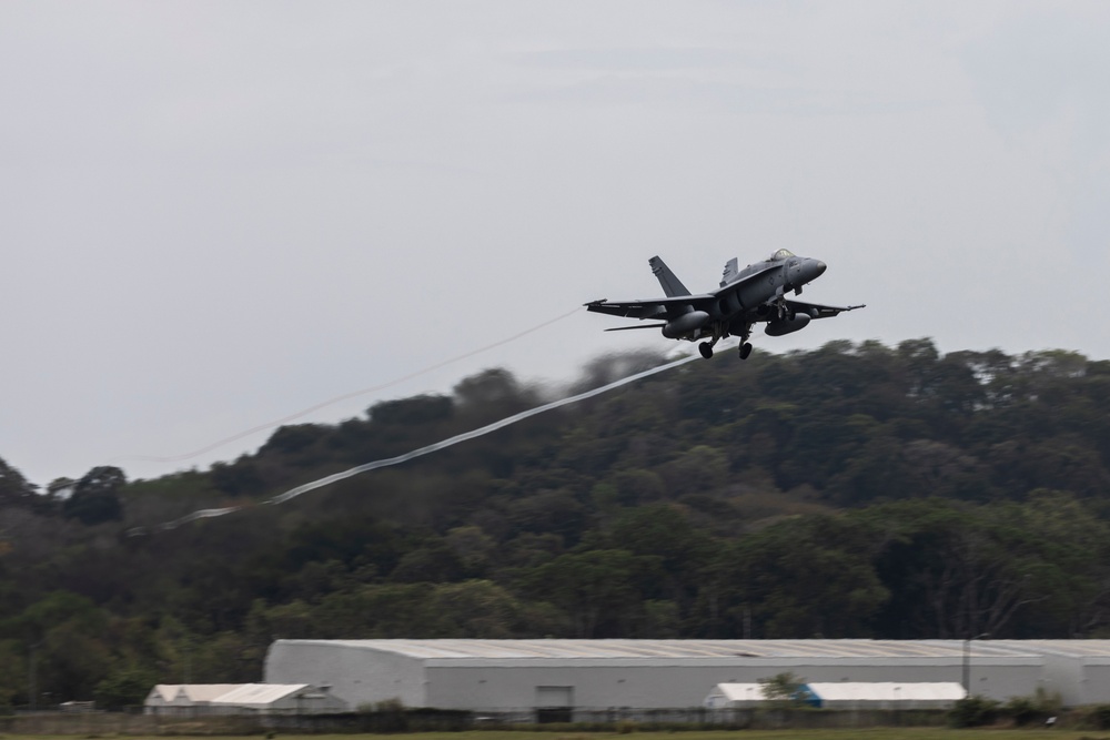 U.S. Marines and Panamanian civilian contractors launch F/A-18 Hornets