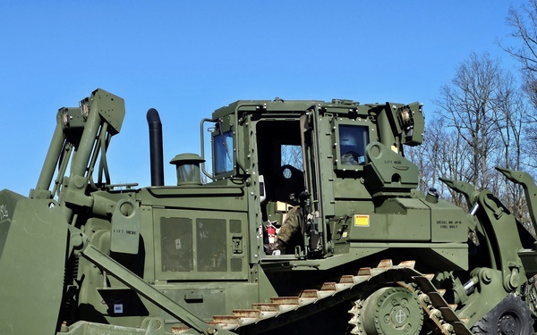 Polish servicemembers train on loading, moving U.S. Army APS-2 heavy construction vehicles
