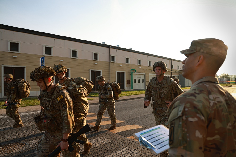 Soldiers conduct 12-mile ruck march at Best Squad Competition in Italy