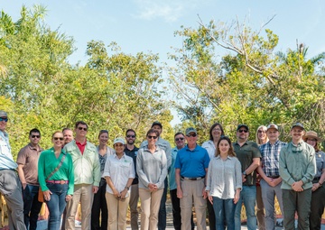 The Transportation and Infrastructure subcommittee staff delegates, USACE staff, SFWMD staff and other partners posed for a photo on the Chinese bridge in the Deering Estates