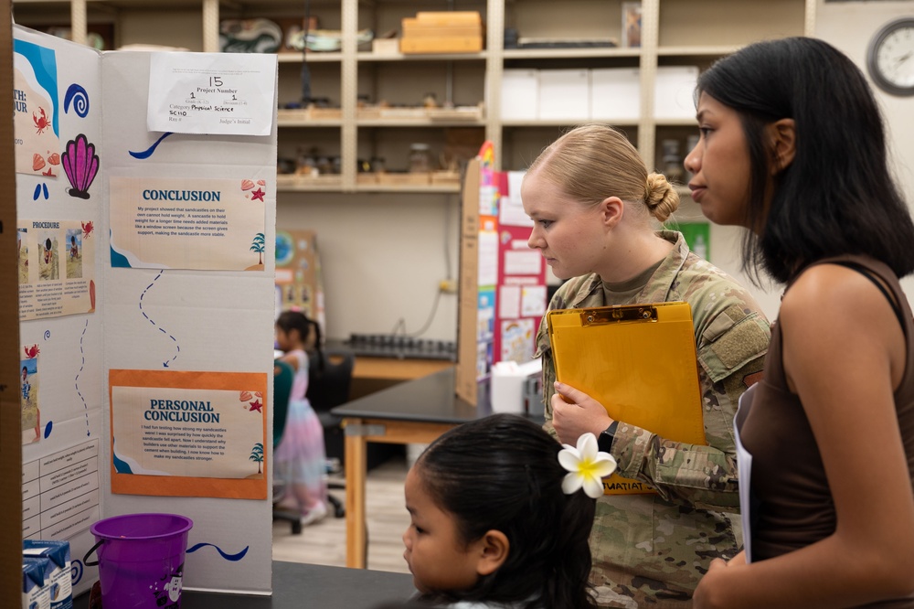 36th MDG Airmen volunteer as judges in the Guam Island Wide Science Fair